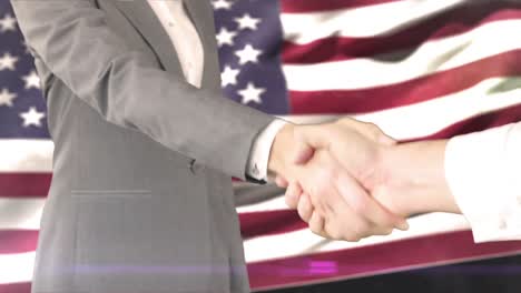 business handshake against american flag