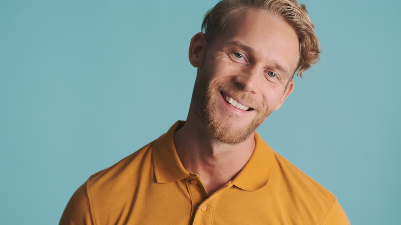 Bearded guy smiling and posing