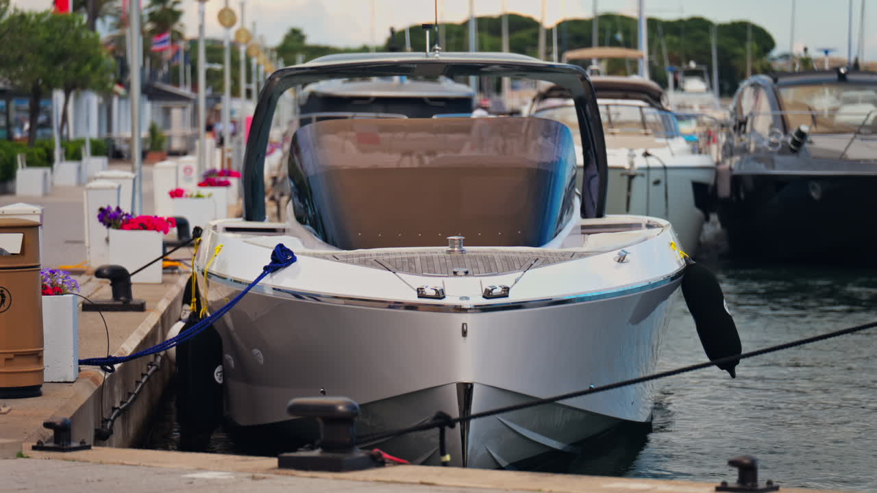 Close up of a boat docked in Port Vauban in Antibes, France in the evening