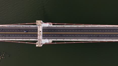 top down flying over suspension bridge