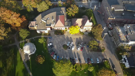 aerial drone shot looking down over the patten free library, moving towards the kennebec river