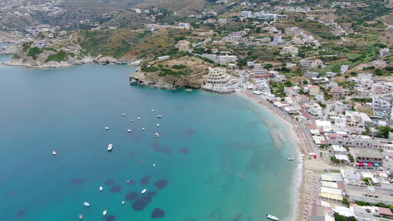 High angle aerial of a scenic town on the coast of Aegean sea, Crete, Greece