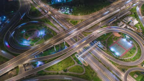 4k time-lapse or hyper-lapse aerial view highway road circle or intersection traffic at night for transportation concept.