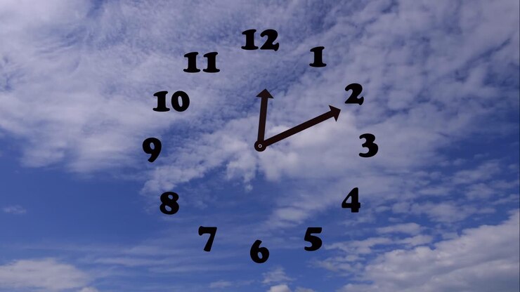 Time lapse shot of running time on clock with cloudscape in motion against blue sky
