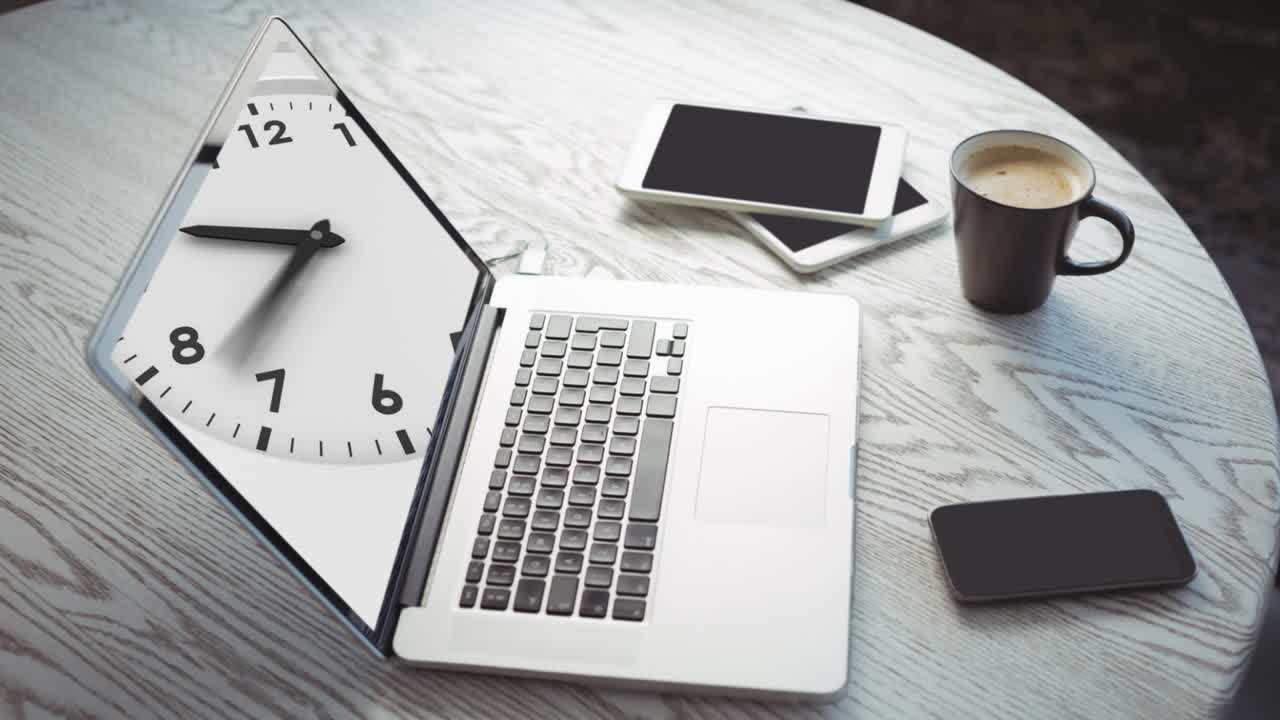 Animation of a laptop showing clock ticking on the screen with tablets and a smartphone