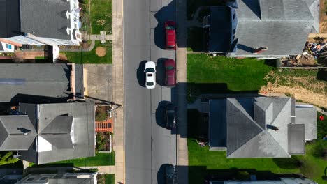 aerial drone above american town usa countryside spring roads car drives urban residential area