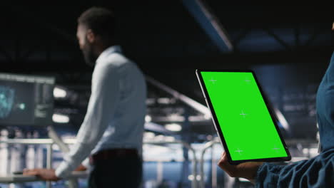 close up of server hub admin using isolated screen tablet next to colleague