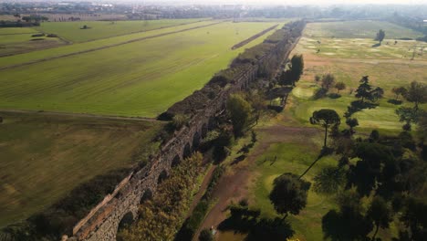 beautiful aerial drone view above claudio aqueduct in rome, italy