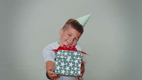 toddler toddler boy presenting birthday gift box offer wrapped present career bonus celebrating