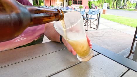 sequence of beer being poured into a glass.