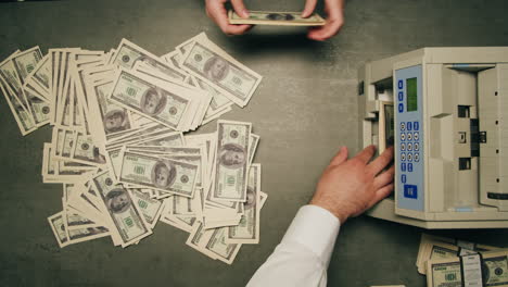 specialised police officer counting dollar banknotes in crime lab, conceptual image. high quality 4k footage