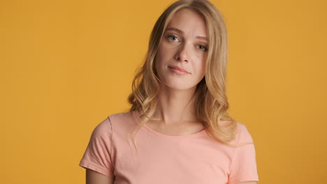 Caucasian woman calmly looking at camera.