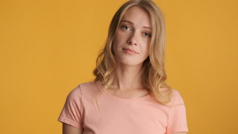 caucasian woman calmly looking at camera.