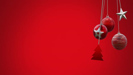 animation of hanging baubles, tree and star swinging against red background