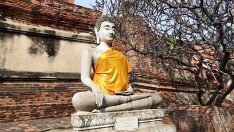 buddha statue with yellow robe in ayutthaya