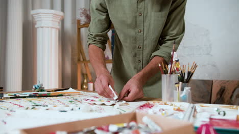 man choosing colors and tools