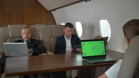 businesspeople have meeting in corporate jet