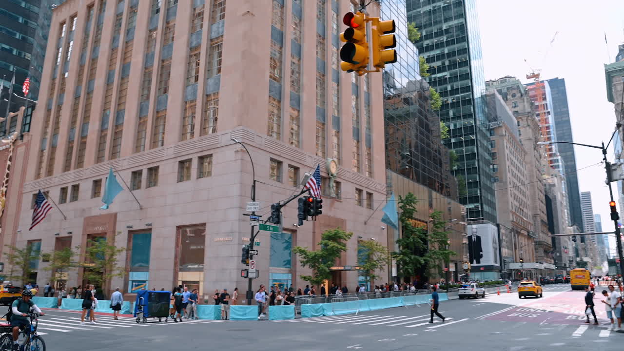 New York, USA, 4 August 2025: Crowded street with shops and skyscrapers in New York City. Busy street in Manhattan with crowds of people, shops, and modern skyscrapers towering above
