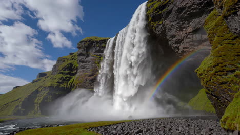 majestic skogafoss waterfall with rainbow in iceland