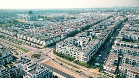 Aerial-view-of-residential-houses-neighborhood-and-apartment-building-complex-at-sunset