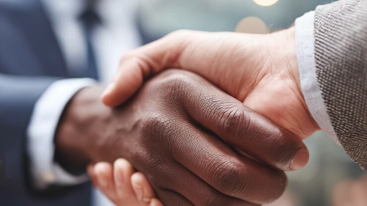 A Firm Handshake Symbolizing Trust and Partnership Between Two Professionals in a Business Setting, Reflecting Collaboration and Mutual Respect in Corporate Culture