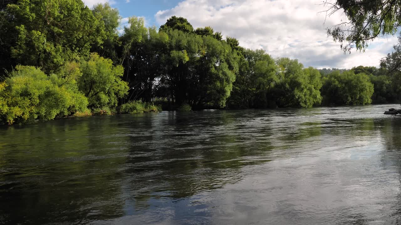 Wide view of Tumut River in Tumut in the Snowy Mountain Region of Australia, New South Wales.
