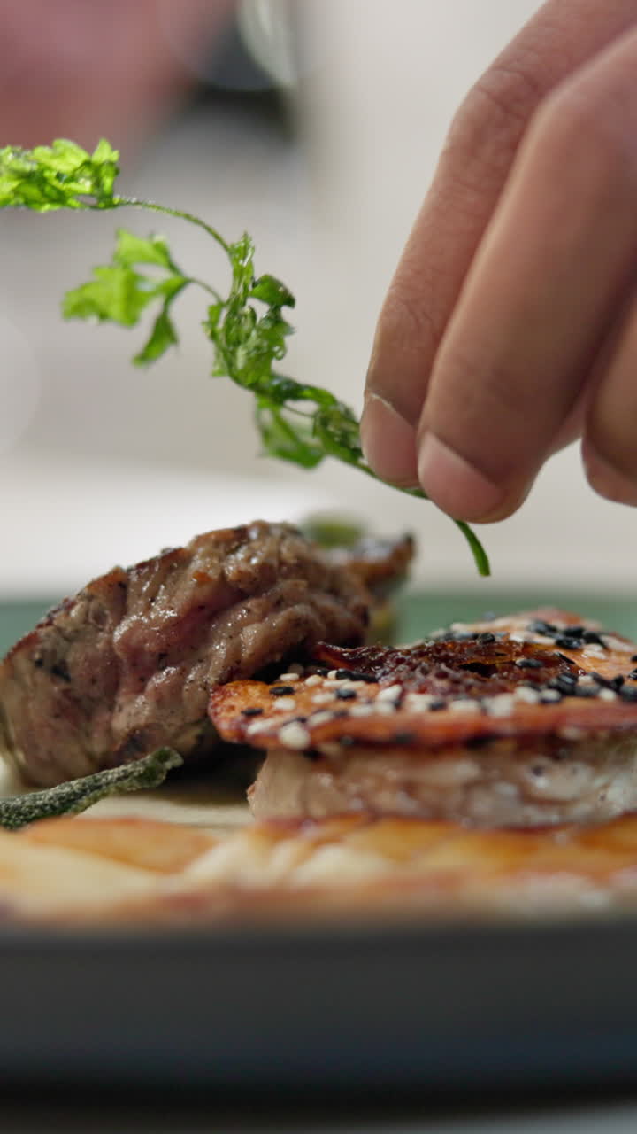 Steak dish being garnished