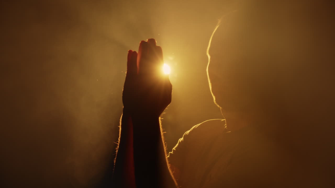 Studio Silhouette of Praying Hands on Third Eye Chakra, Mystery Ritual Light