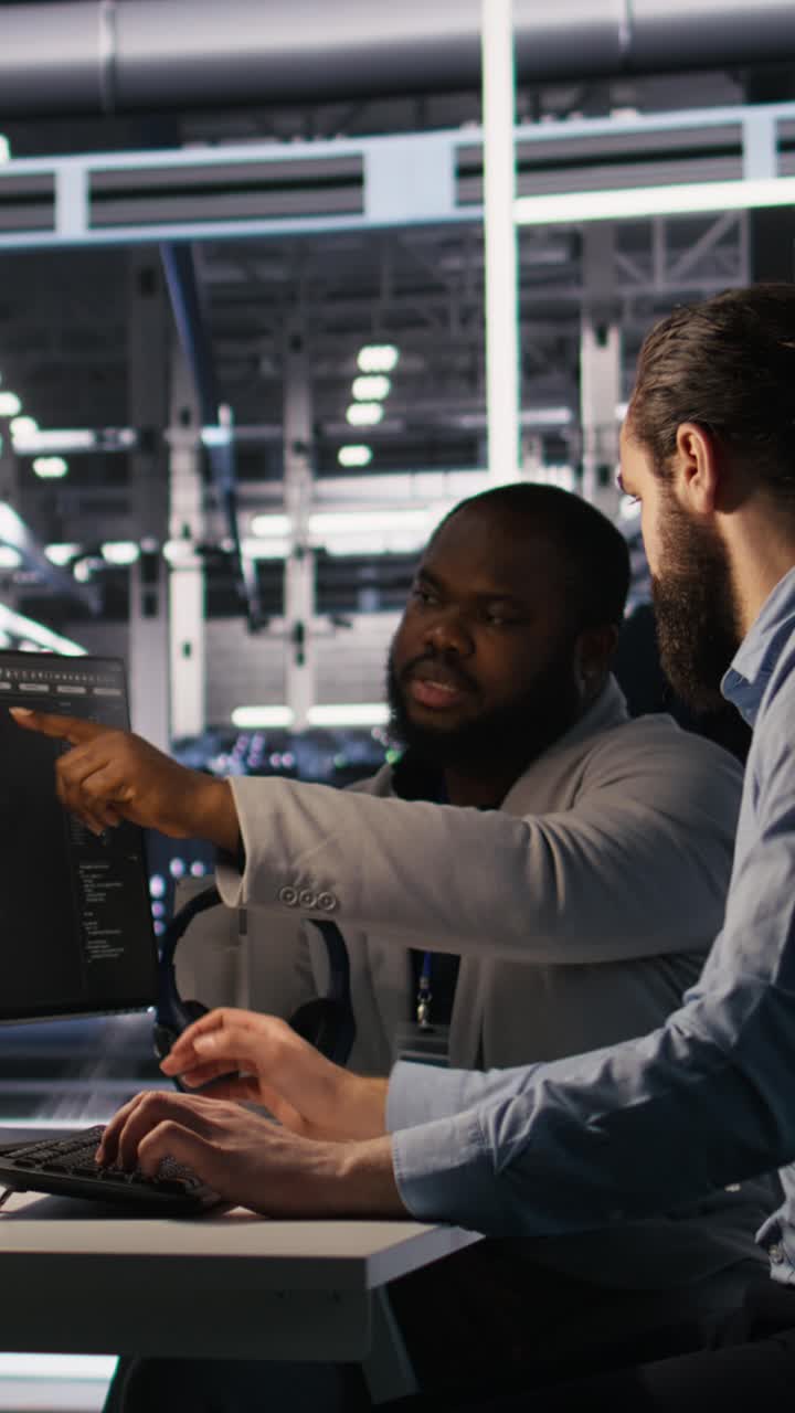 Vertical video Lead data center engineer overseeing team integrating AI automation tools