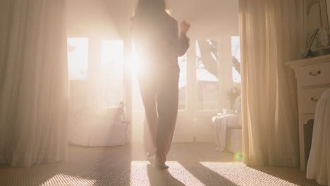 beautiful-teenage-ballerina-girl-practicing-ballet-dancing-in-bedroom-rehearsing-dance-on-weekend-morning-wearing-pajamas-at-sunrise