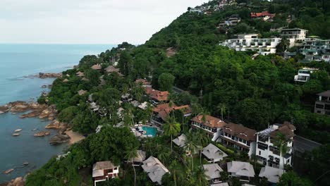 drone revealing koh samui island thailand travel destination with waterfront resort near llama beach