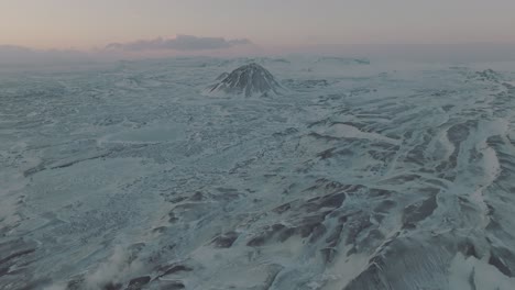 Peaceful-Iceland-Landscape-with-Snowy-Mountain-Peaks-at-Sunset---Aerial-Panning-View