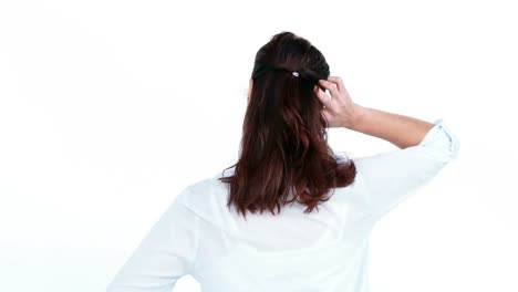 rear view of woman scratching her head