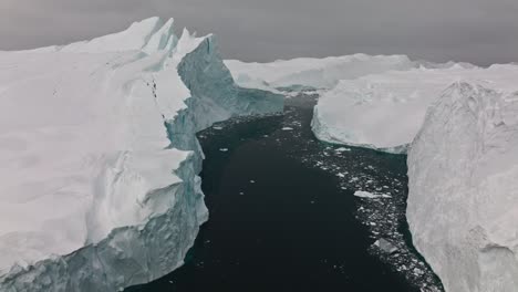 drone over sea and ice of ilulissat icefjord