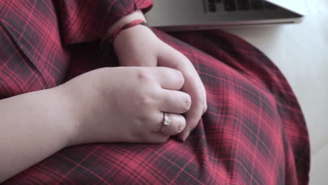 Close-up-of-hands-of-a-modern-Indian-woman-wearing-a-wedding-ring