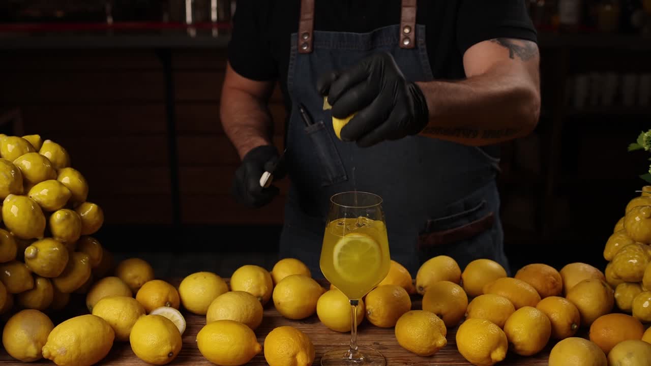 Bartender preparing a lemon cocktail