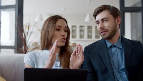 business woman arguing with man at home office