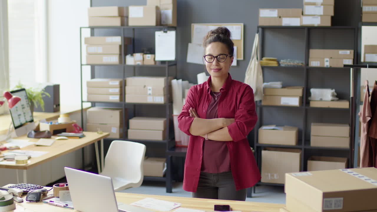 Female Manager Posing for Camera in Delivery Service Office