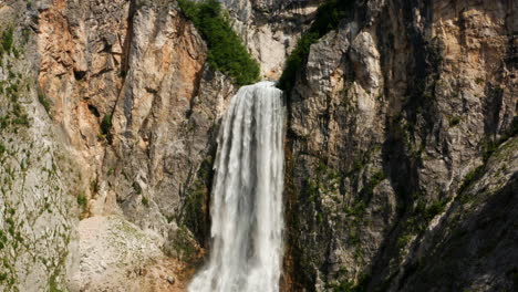 mightiest waterfall with water cascading down on limestone cliff