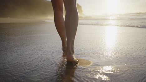 woman running on a beach at sunset