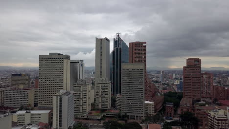 aerial shot towards bogota skyline in a cloudy day