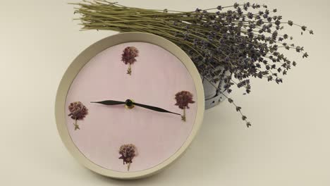 clock against the background of a basket of flowers