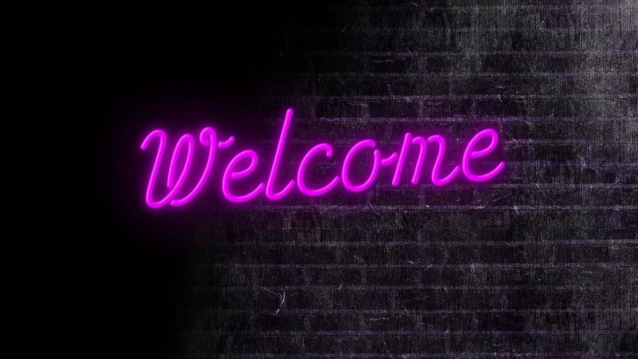 Animation of neon welcome text over black brick wall