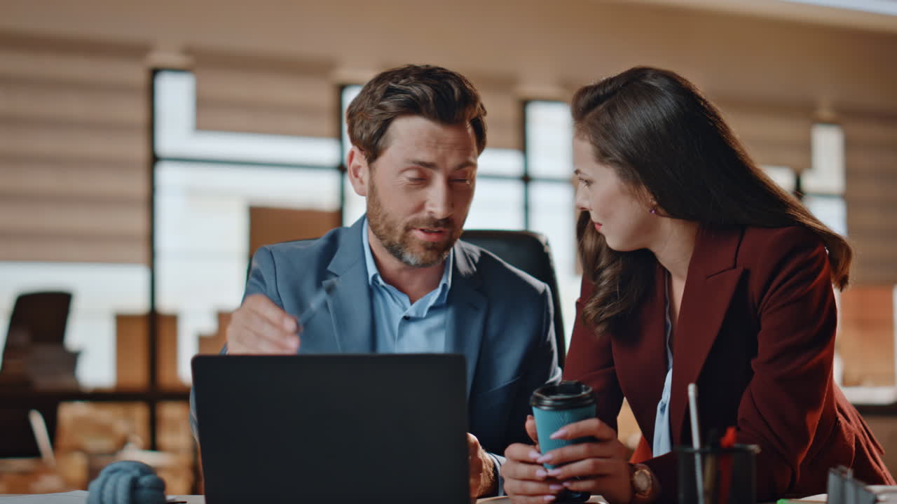 Business partners giving five celebrating success at office. Colleagues working