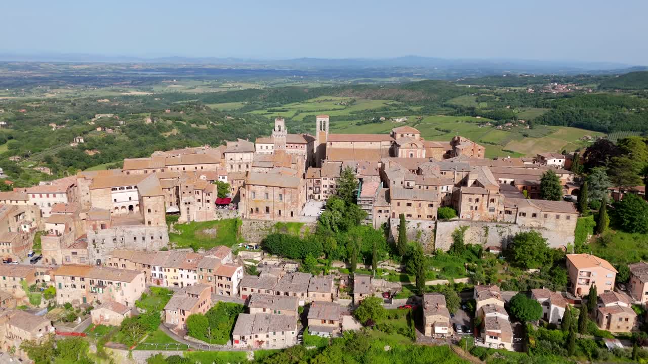 The Medieval Hilltop Town Of Montepulciano In Tuscany, Italy. Tilting Down Aerial Shot.