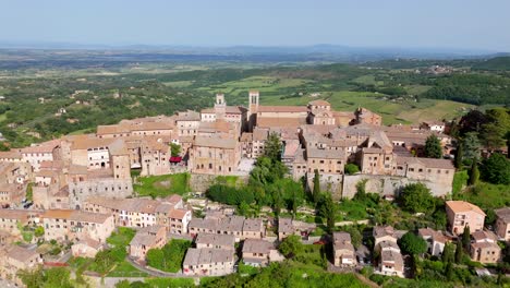 the medieval hilltop town of montepulciano in tuscany, italy. tilting down aerial shot.