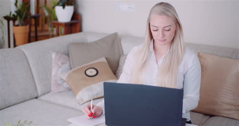 Businesswoman-Working-On-Laptop-On-A-Project-At-Home-Office-Young-Woman-Using-Laptop-Computer-3