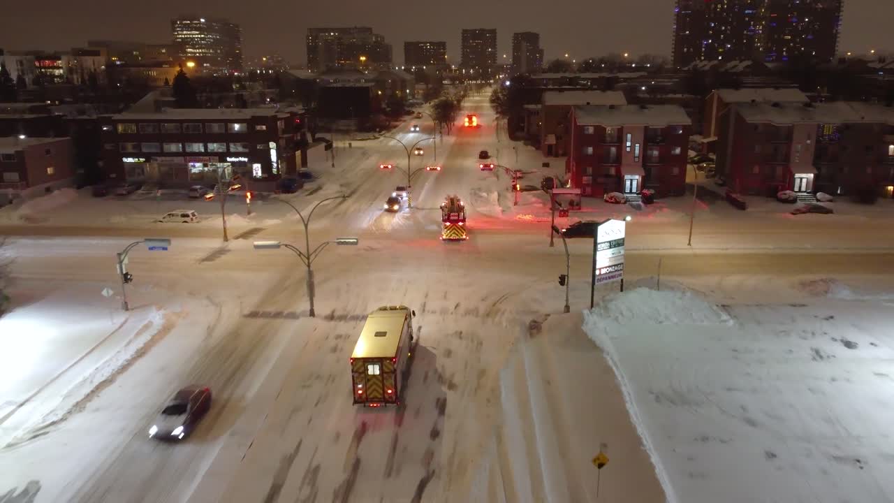 Firetrucks Responding to Emergency on Snowy Night Aerial Laval Canada