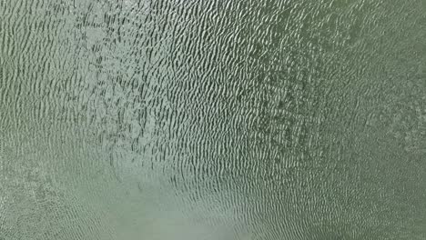 abstract aerial drone shot of water ripples