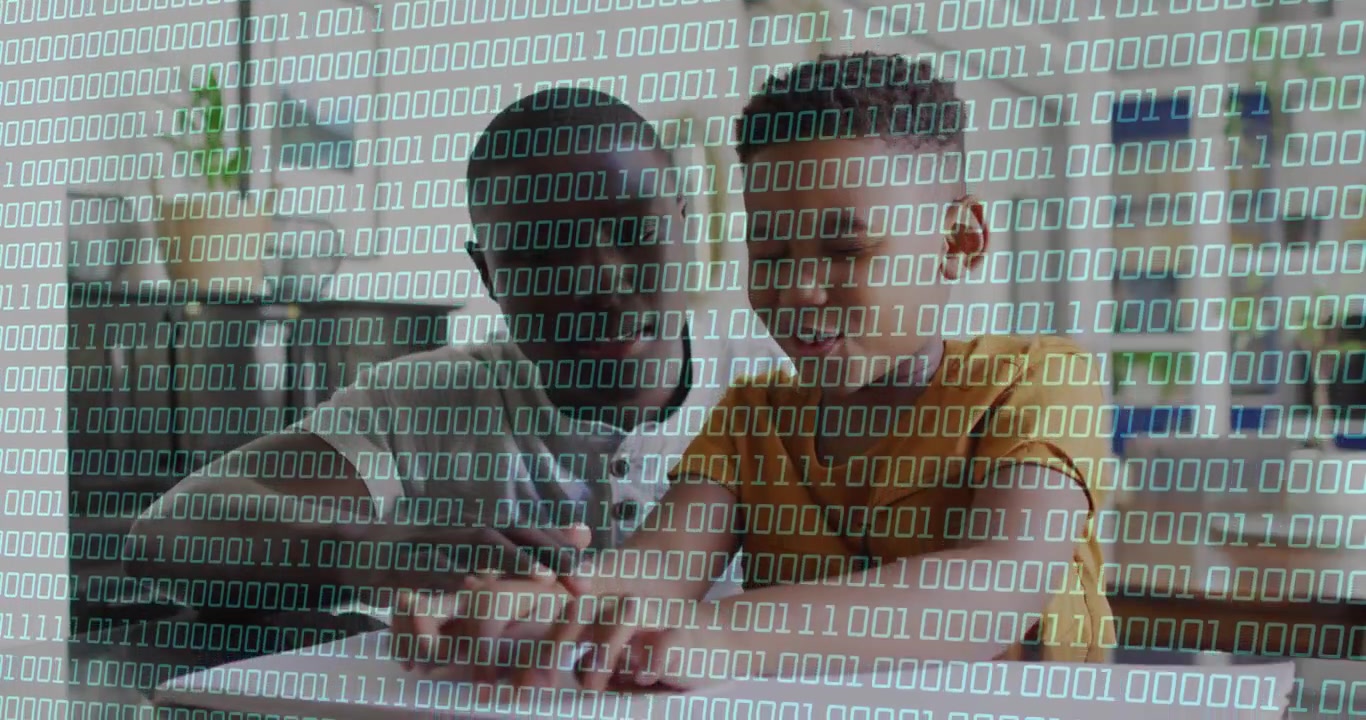 Vertical video: Adult leaning, pointing at paper, teaching by guiding boy writing binary over frame
